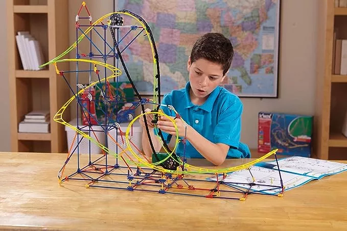 Child plays with K'NEX STEM Exploration Roller Coaster